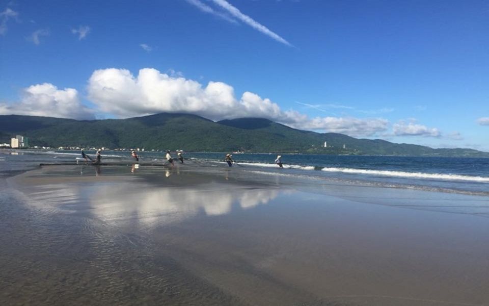 Da Nang: Private City Tour by Scooter with Ao dai Lady Rider - My Khe Beach: quick, scenic, and easy to read